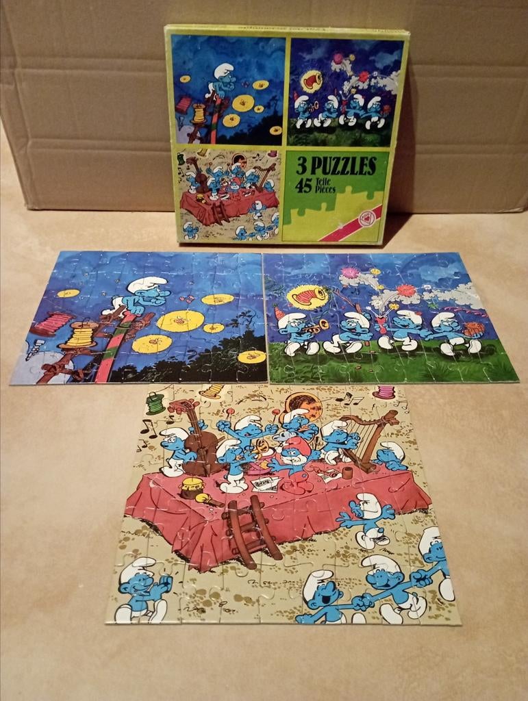 Drie puzzels van De Smurfen "La fête des Schtroumpfs" (Peyo), Collections, Schtroumpfs, Utilisé, Autres types, Différents Schtroumpfs