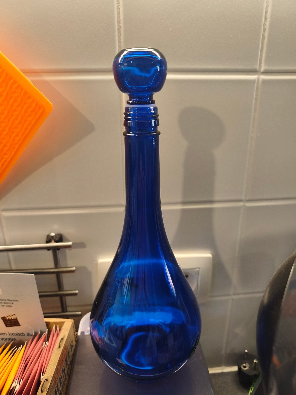 Blauwe fles, Ophalen