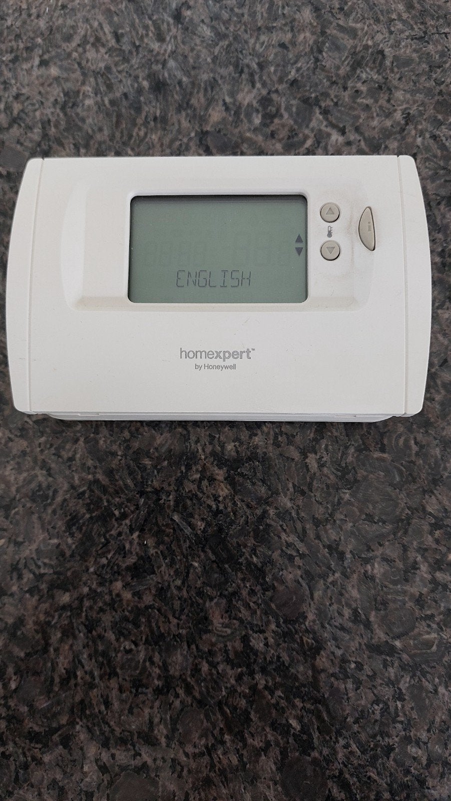Thermostat Homexpert de Honeywell
Éloigner en plaçant les au, Enlèvement ou Envoi