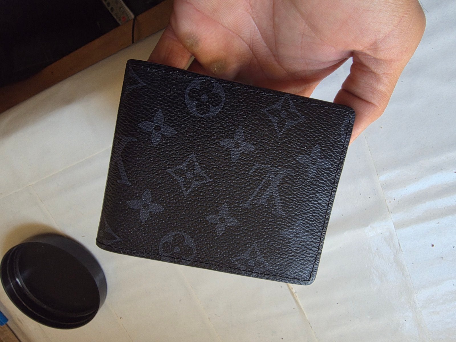 porte feuille homme, Enlèvement