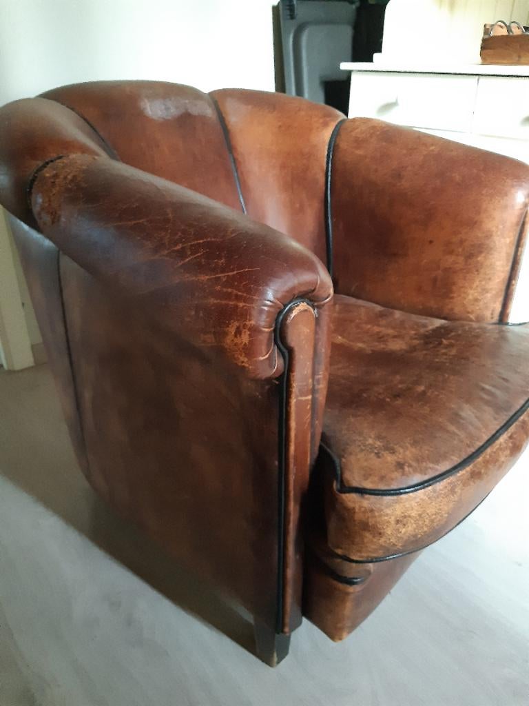 Oud schapenleren fauteuil, Ophalen