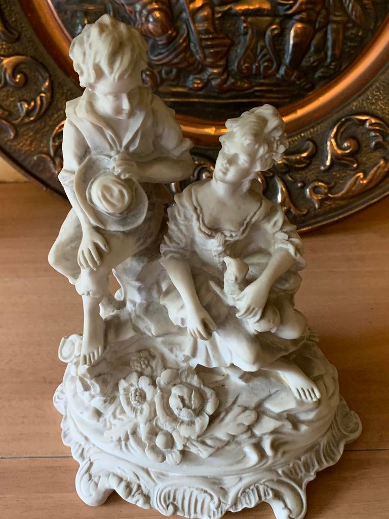 Beeldje man en vrouw, Ophalen
