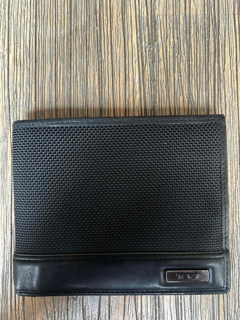Porte-feuille noir marque TUMI, Ophalen, Gebruikt, Zwart, Leder