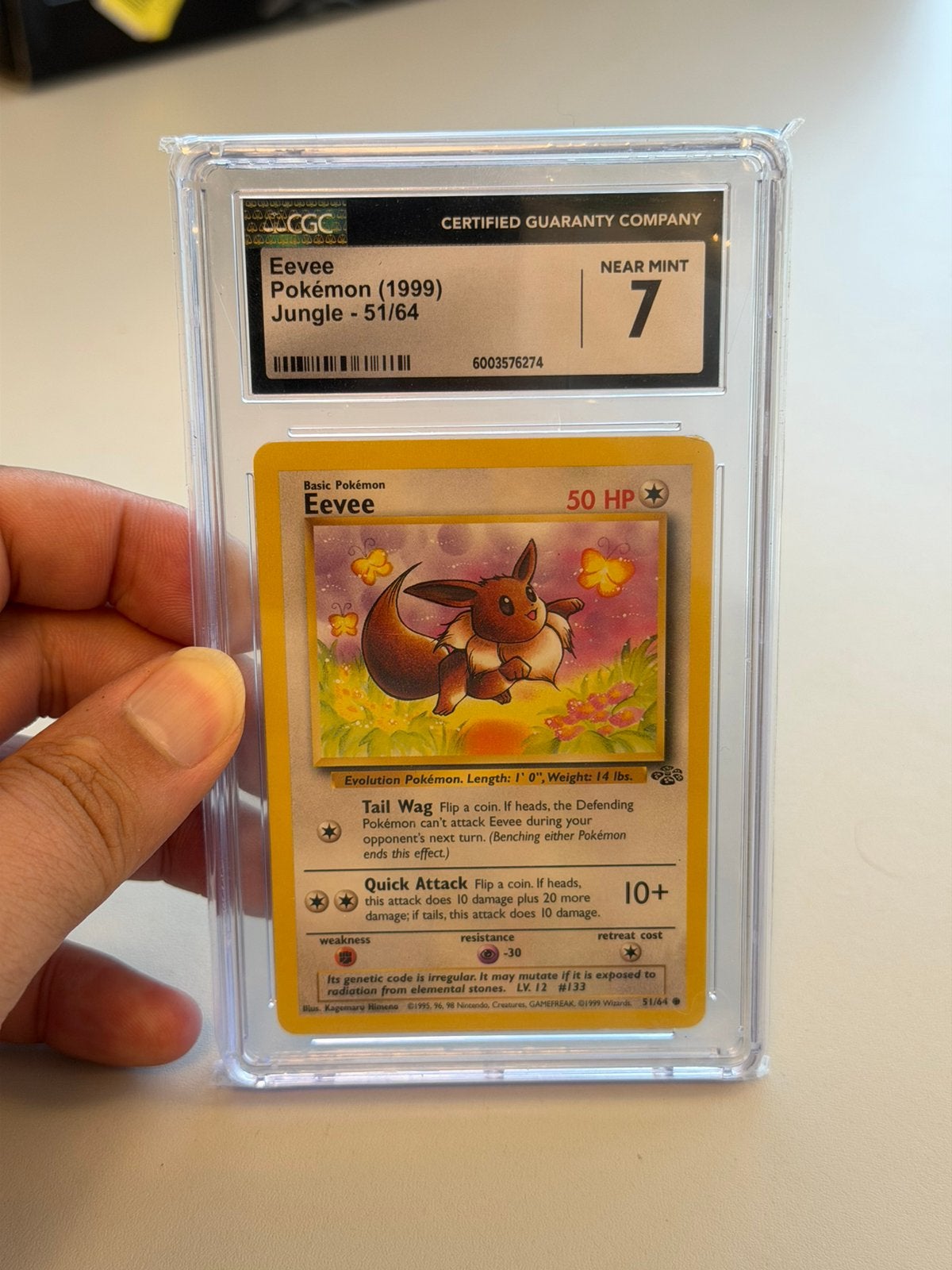 Eevee 51/64 Jungle 1999 CGC 7 Near Mint Pokémon slab vintage, Hobby en Vrije tijd, Verzamelkaartspellen | Pokémon, Ophalen of Verzenden