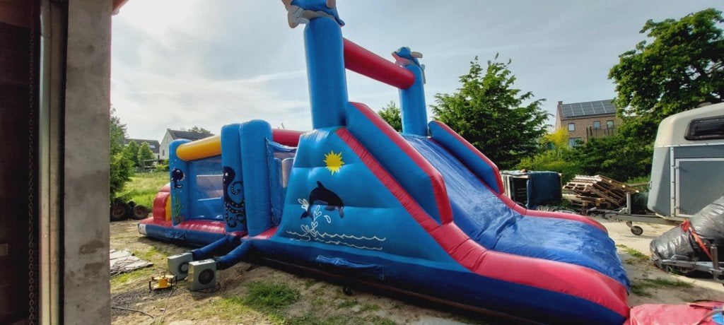 LOCATION: Château gonflable Dauphin Toboggan+Obstacles, Enlèvement, Comme neuf