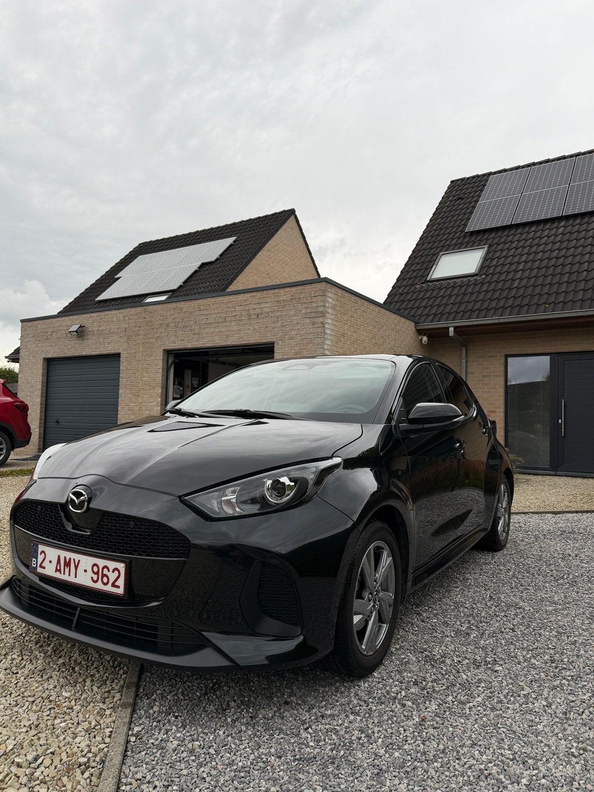 Mazda 2 Hybride 08/2024 Exclusive line, Auto's, Dealer onderhouden, Stof, 4 cilinders, Zwart