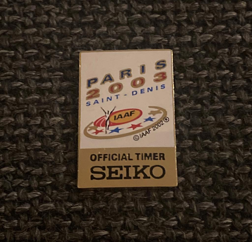 PIN - IAAF - PARIS 2003 - SAINT DENIS - SEIKO, Envoi, Utilisé, Autres sujets/thèmes, Insigne ou Pin's