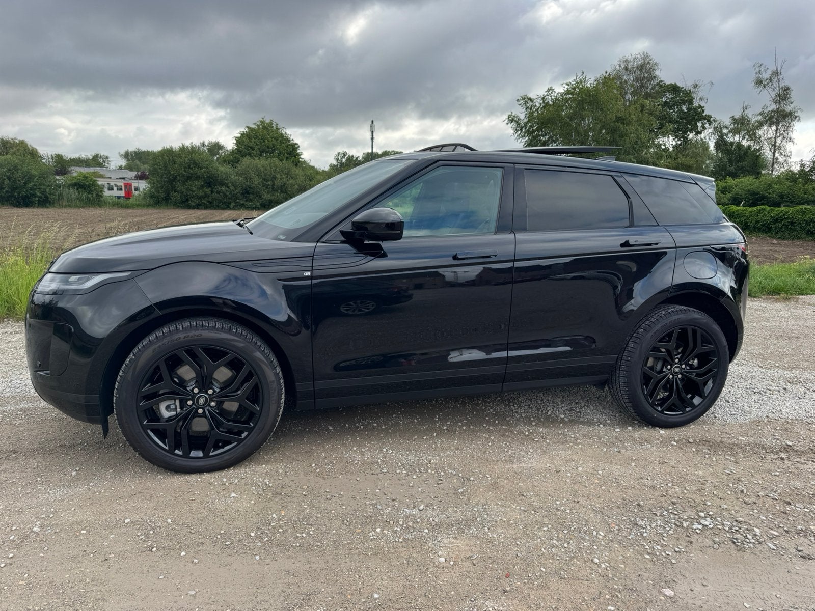 Range Rover Evoque hybride P300e AWD Santorini Black, Auto's, Land Rover, Automaat, Zwart, Leder, SUV of Terreinwagen
