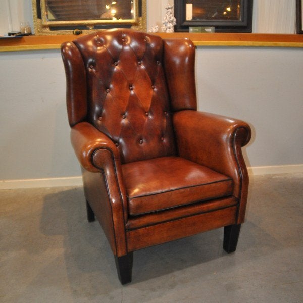 Grote schapenleren fauteuil met knopen., Ophalen