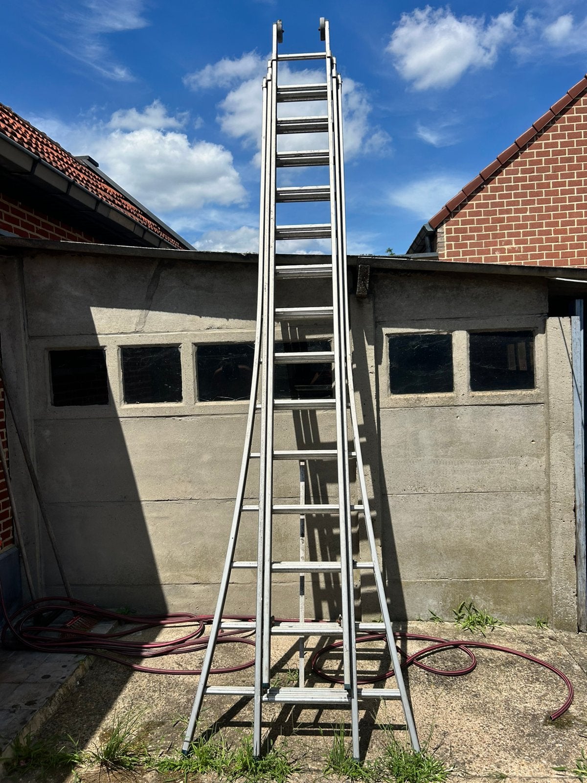 Professionele aluminium schuifladder 3-delig 12 meter, Doe-het-zelf en Bouw, Ophalen, Gebruikt, Ladder, 4 meter of meer