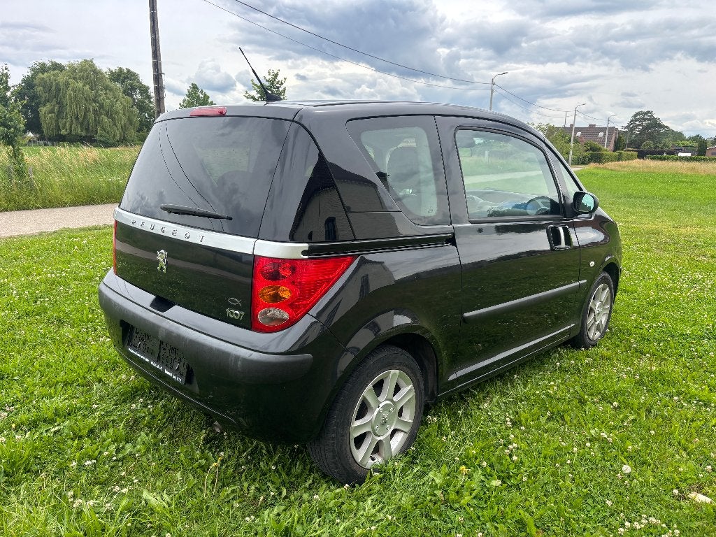 Peugeot 1007 1.4i AUTOMAAT 127.000km AIRCO alle LEZ, Auto's, Stof, 4 cilinders, 149 g/km, Zwart
