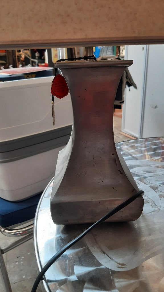 Tinnen lampadaire, Ophalen
