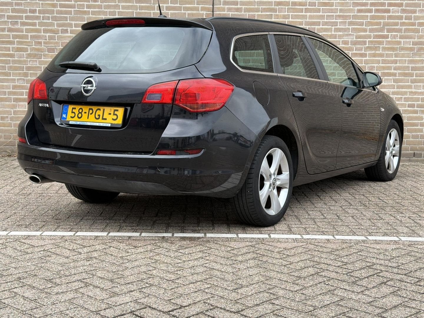 Opel Astra Sports Tourer 1.4 Turbo Edition | Cruise | Airco, Auto's, 144 g/km, Zwart, Electronic Stability Program (ESP), Zwart