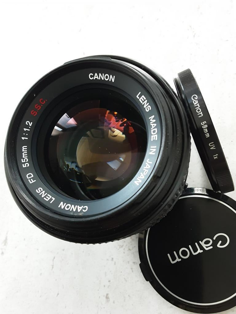 Objectif Canon FD 55mm 1:1.2 S.S.C, filtre UV Canon, comme n, TV, Hi-fi & Vidéo, Photo | Lentilles & Objectifs, Enlèvement ou Envoi