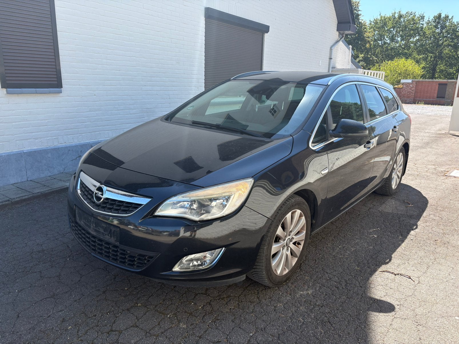 Opel Astra sports tourer 2012 airco / leder, Auto's, Euro 5, Zwart, Zwart, Leder