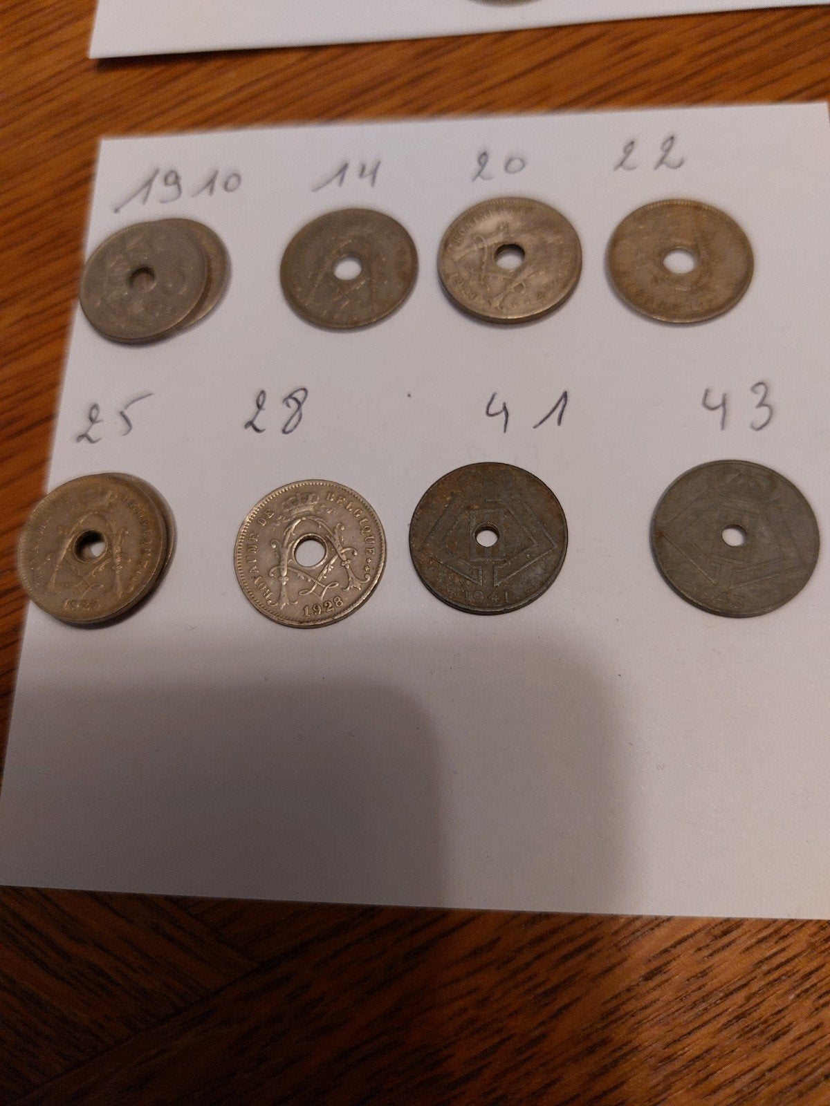 12 belgische munten van 5 cent (met gat erin), Ophalen
