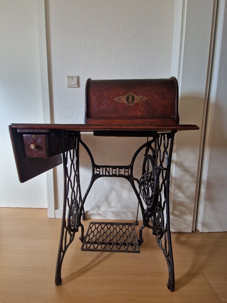 Oud Singer trapnaaimachine., Ophalen