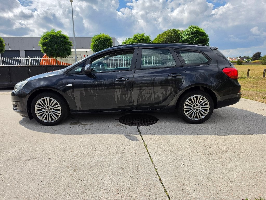 Opel Astra Sports Tourer 1.4i Airco Gekeurd + Garantie, Auto's, Euro 5, Zwart, 5 deurs, Dealer onderhouden