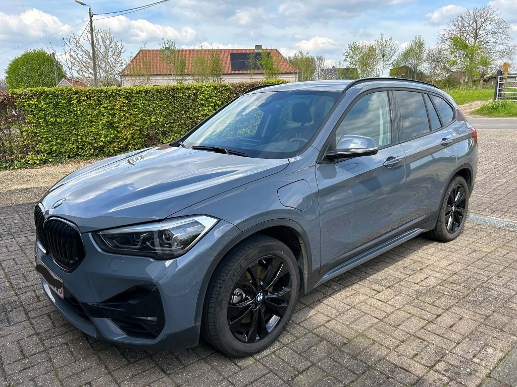 BMW X1 xDrive25e Sport Line, Auto's, Dealer onderhouden, Blauw, Leder en Stof, 5 zetels