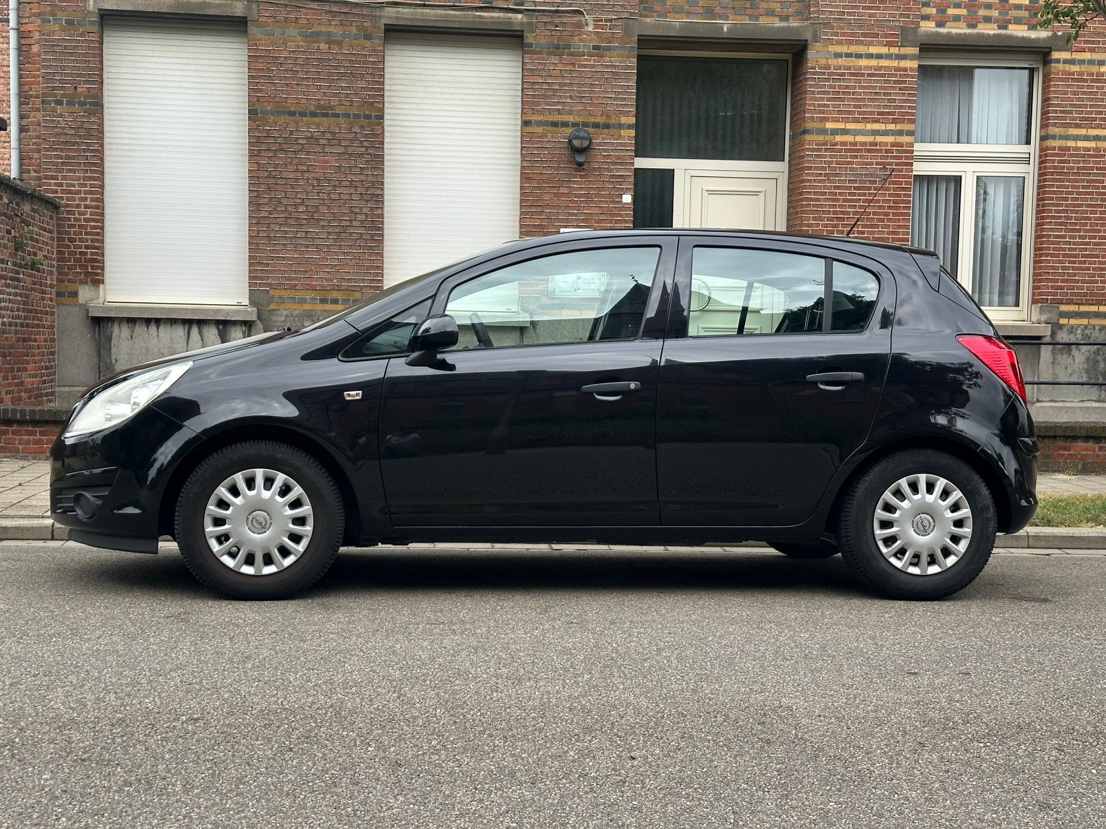 Opel Corsa 1.3 Benzine–2010–Km 28.000–Gekeurd voor verkoop, Auto's, Opel, Stof, Zwart, Adaptieve lichten, Zwart