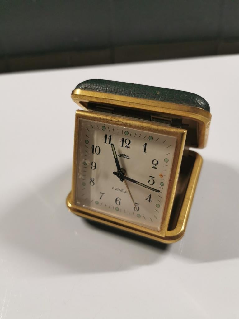 Antieke reiswekker. Primm's. 2Jewelry, Ophalen of Verzenden