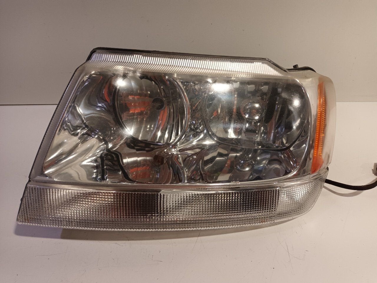 Koplamp links Jeep Grand Cherokee, Jeep, Onderdelen@venauto.nl, Van der Ven Autorecycling B.V., Gebruikt