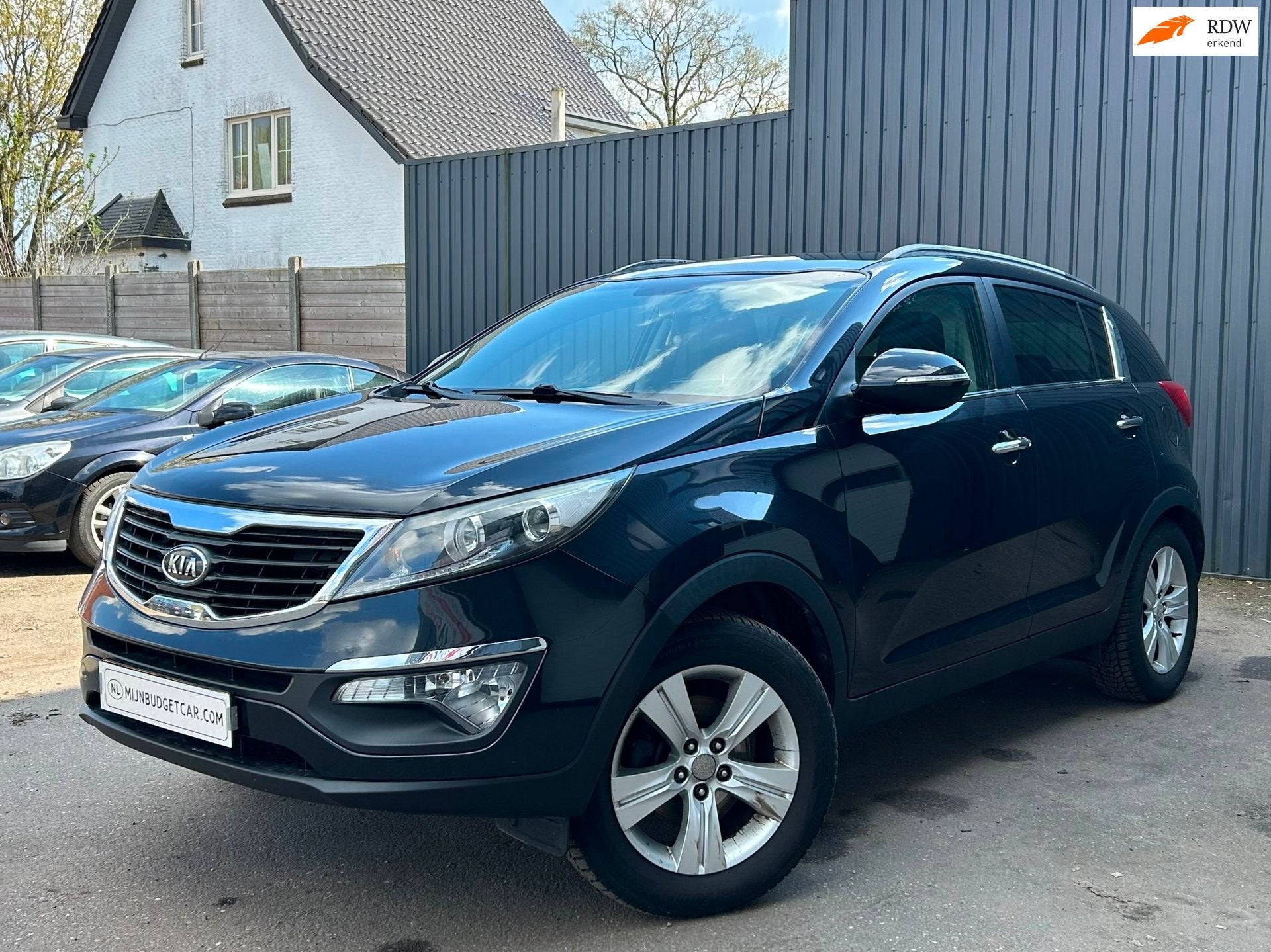 Kia Sportage 2.0 X-ecutive Plus Pack, Auto's, Gebruikt, 4 cilinders, Leder en Stof, Zwart