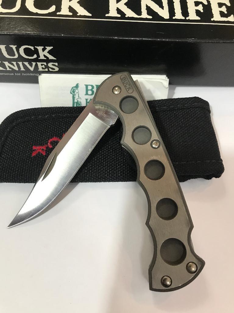 Couteau de chasse pliable en titane BUCK 560 1990 avec étui, Envoi, Comme neuf