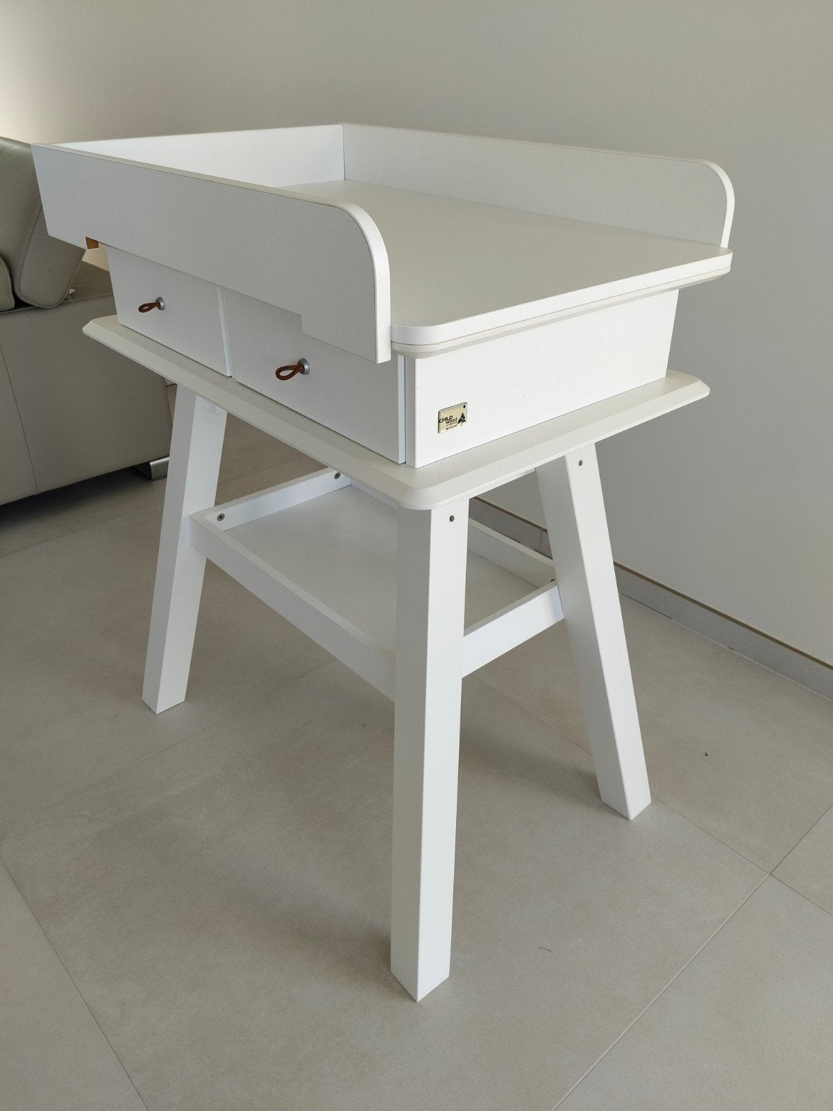 Design verzorgtafel, Ophalen