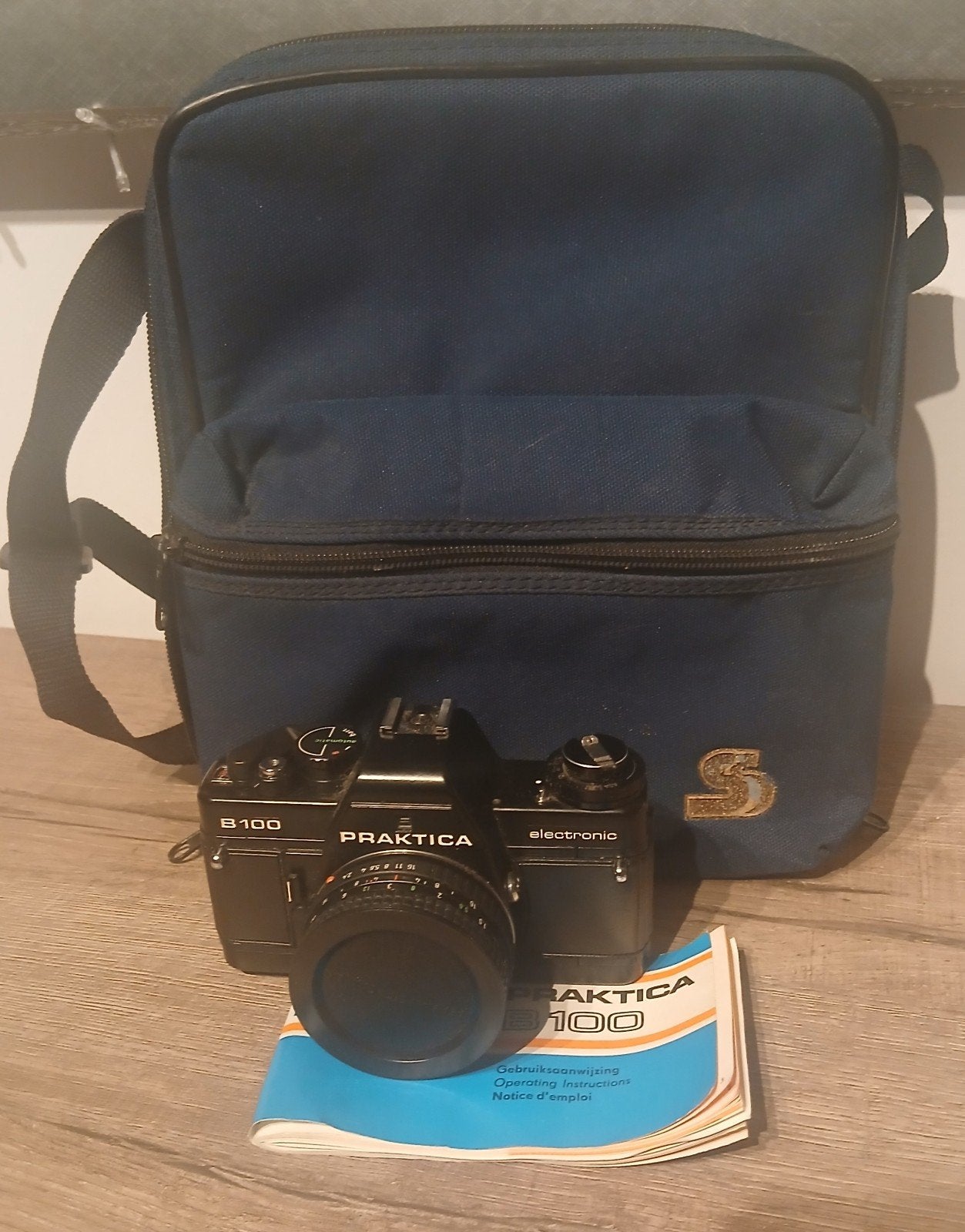Praktica B100 Electronic SLR + Prakticar 50mm f/2.4 MC + Tas, Audio, Tv en Foto, Ophalen, Nikon