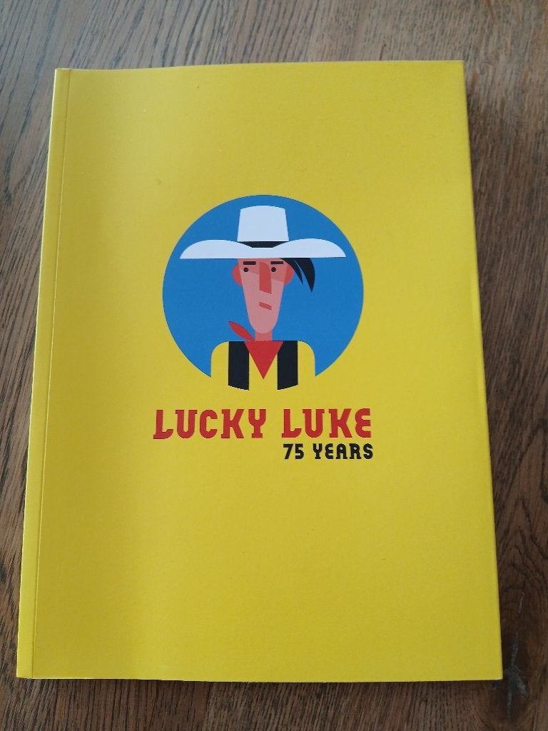 Catalogusboek van de tentoonstelling „Lucky Luke 75 years”, Ophalen, Nieuw