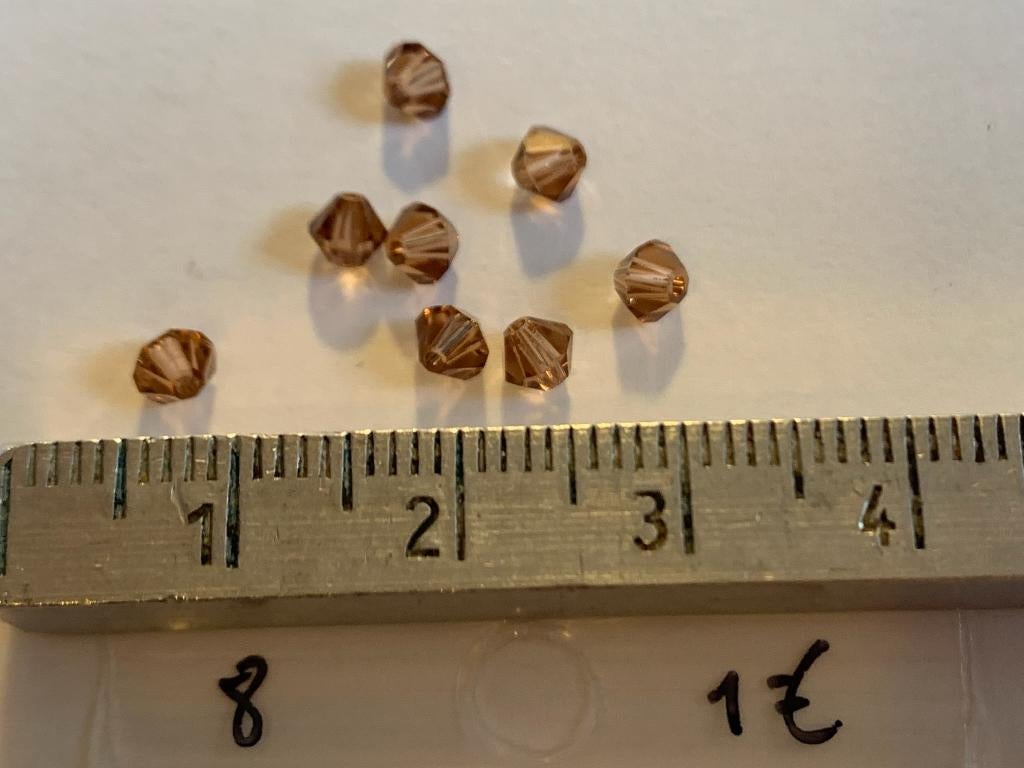 8 Swarovski tolletjes transparant bruin, Ophalen of Verzenden, Nieuw, Kraal