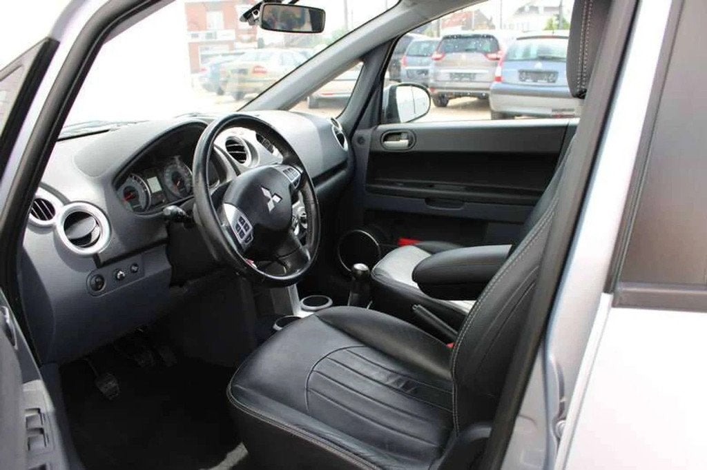 Mitsubishi Colt 1.3i Airco/Cruise Inclusief 3 JAAR garantie!, Auto's, Mitsubishi, Euro 5, Gebruikt, Zwart, 4 cilinders