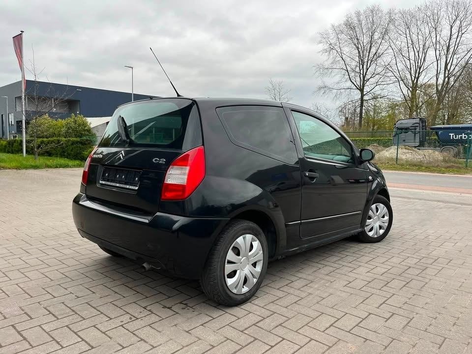 citroen c2 benzine 1.1 2007, Auto's, Citroën, Voorwielaandrijving, Stof, 4 cilinders, Zwart