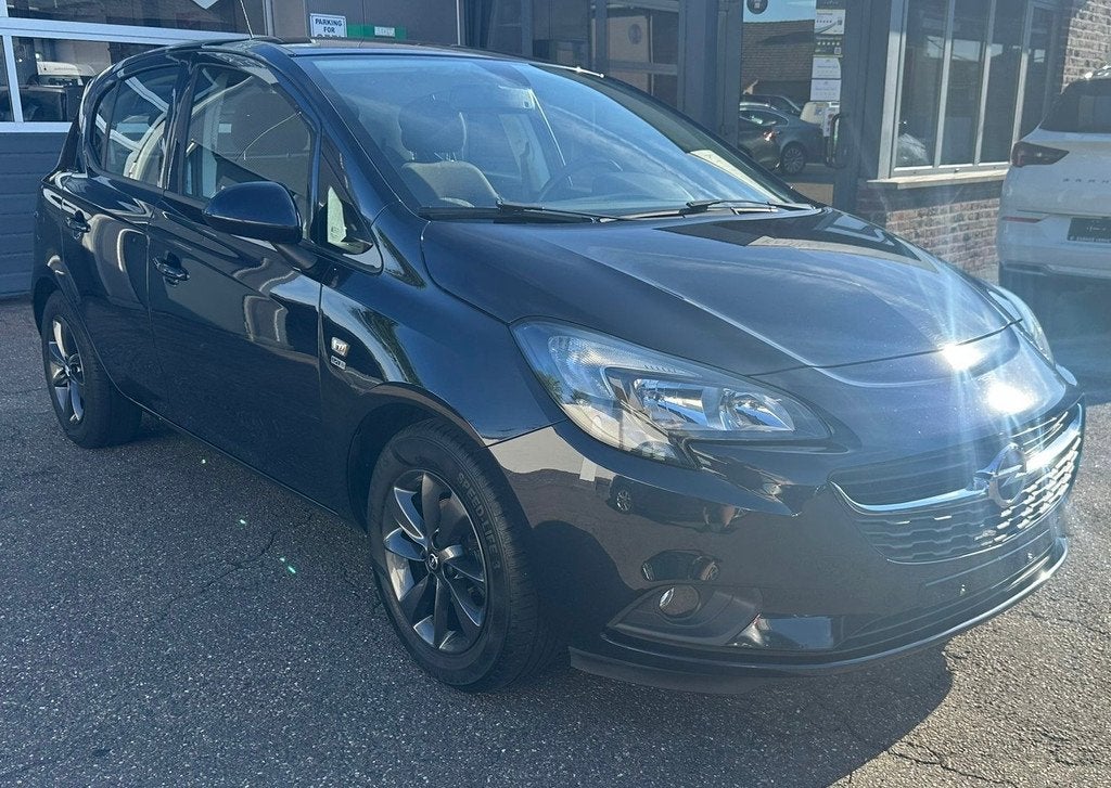 Opel Corsa Corsa E 1200 Benzine 5Drs + ..., Auto's, Stof, Gebruikt, Zwart, Blauw