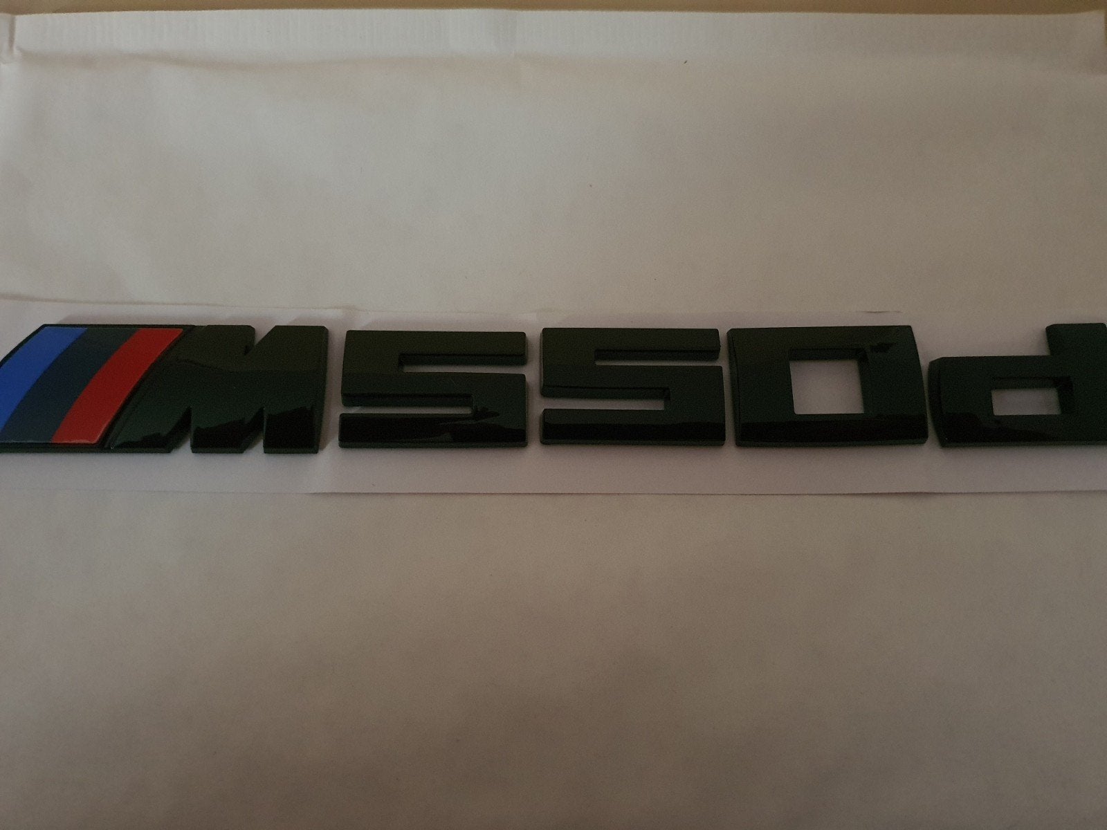 Bmw koffer logo m550d in blinkend zwart, Ophalen of Verzenden