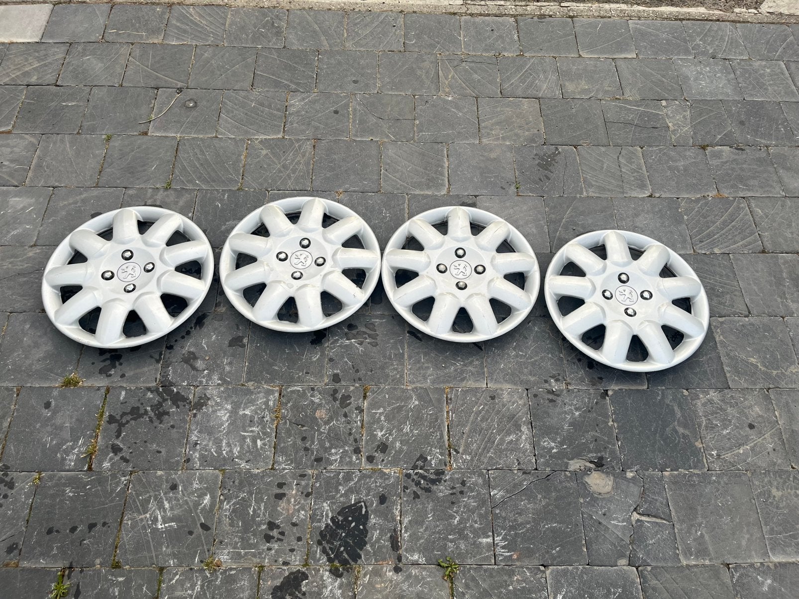 4 originele 15duim peugeot wieldoppen te koop., Enlèvement, Comme neuf