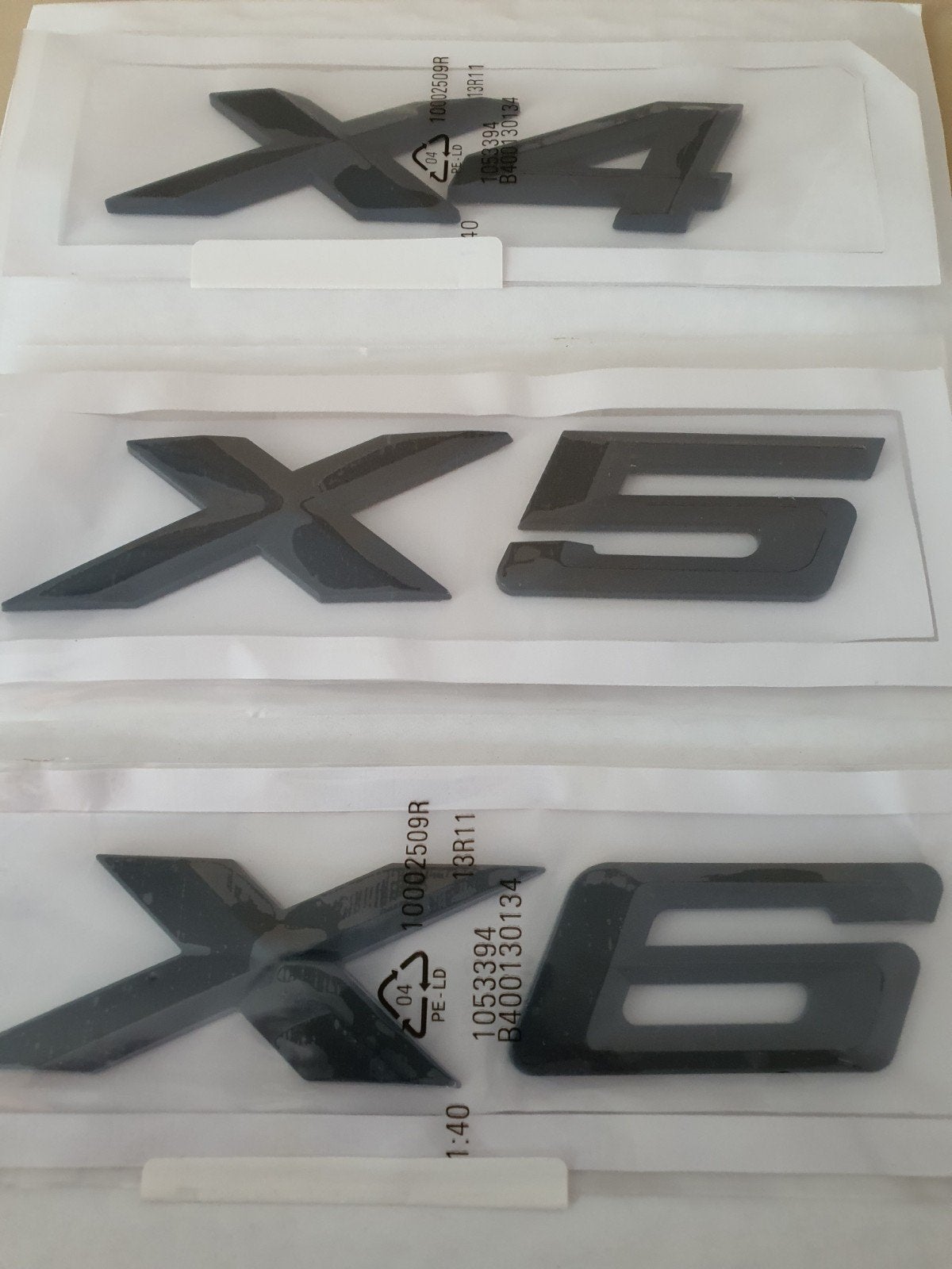 Bmw X4 X5 X6 koffer logo in blinkend zwart, Ophalen of Verzenden