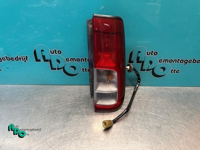Feu arrière droit d'un Suzuki Ignis (Ignis J. 99-), -, 3 mois de garantie, Utilisé, -