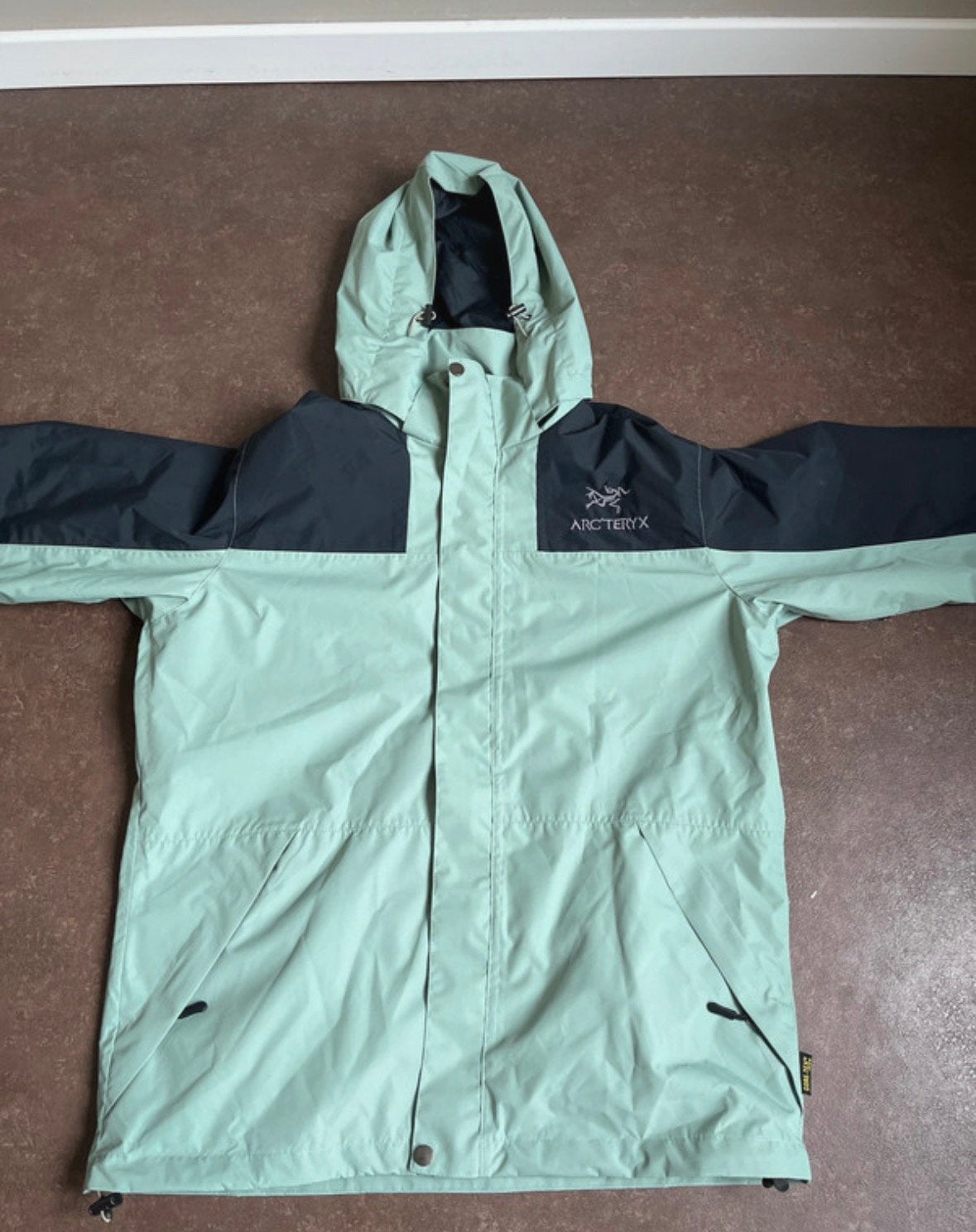 Nieuwe XL grey/green Arcteryx windstopper/rainstopper, Ophalen of Verzenden, Zo goed als nieuw, Maat 56/58 (XL), Groen