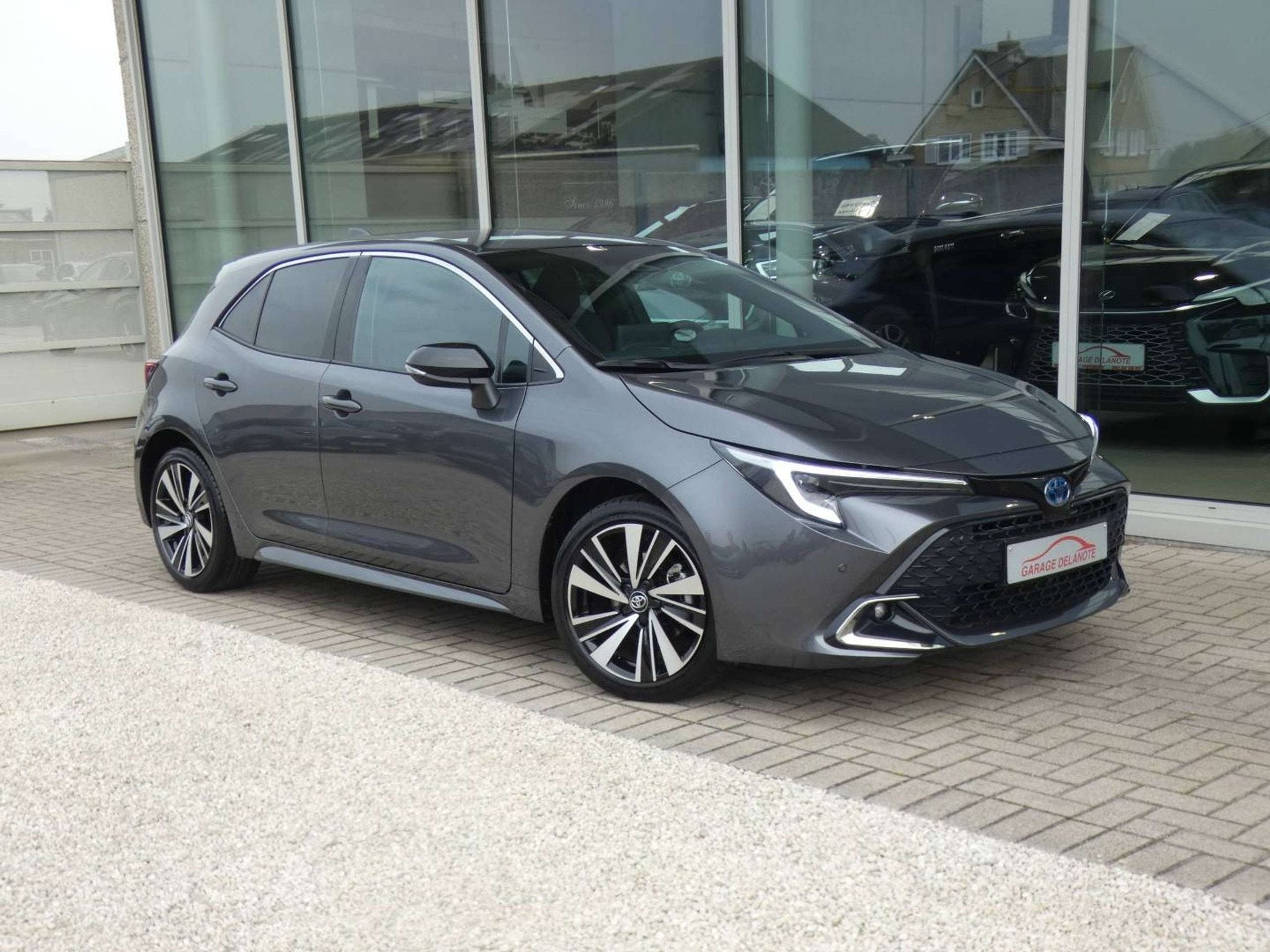 Toyota Corolla HB 1.8 Hybrid STYLE+TECH PACK 140pk +Dodehoek, Auto's, Gebruikt, Zwart, 4 cilinders, Corolla