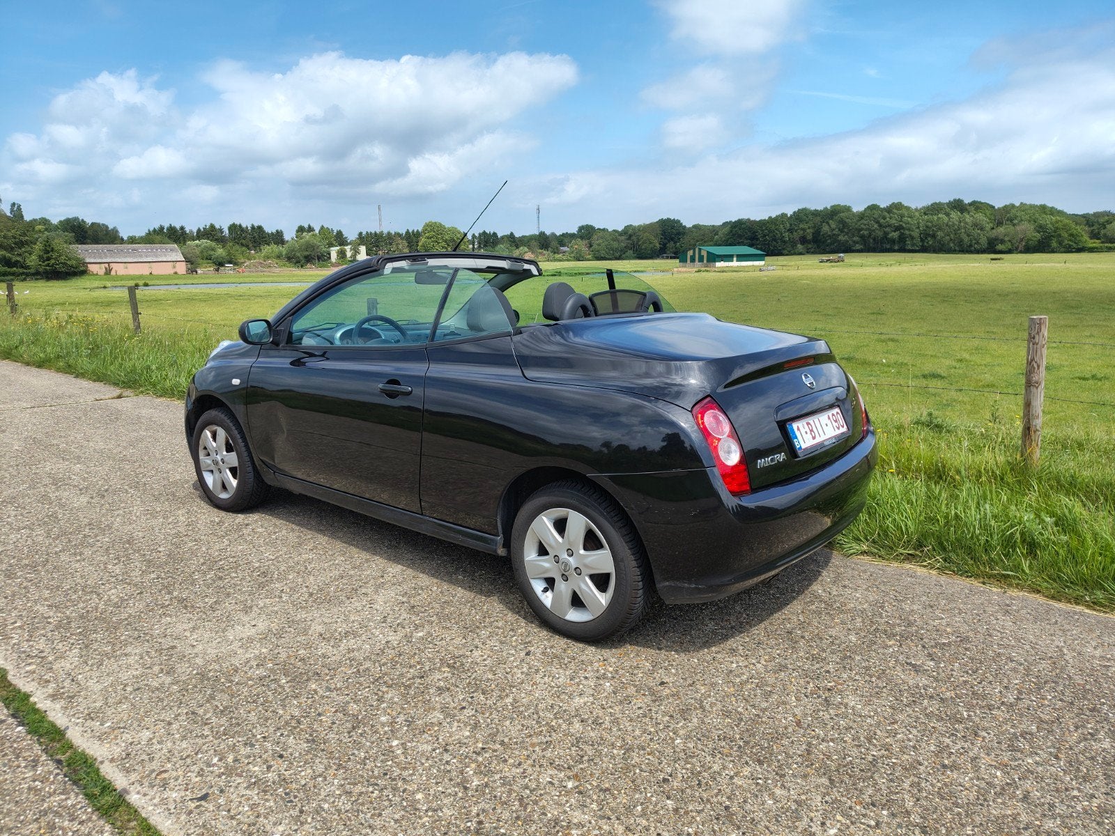 Nissan Micra cabrio 1.4 zwart 88000 km, Auto's, Voorwielaandrijving, 4 zetels, Stof, Cabriolet