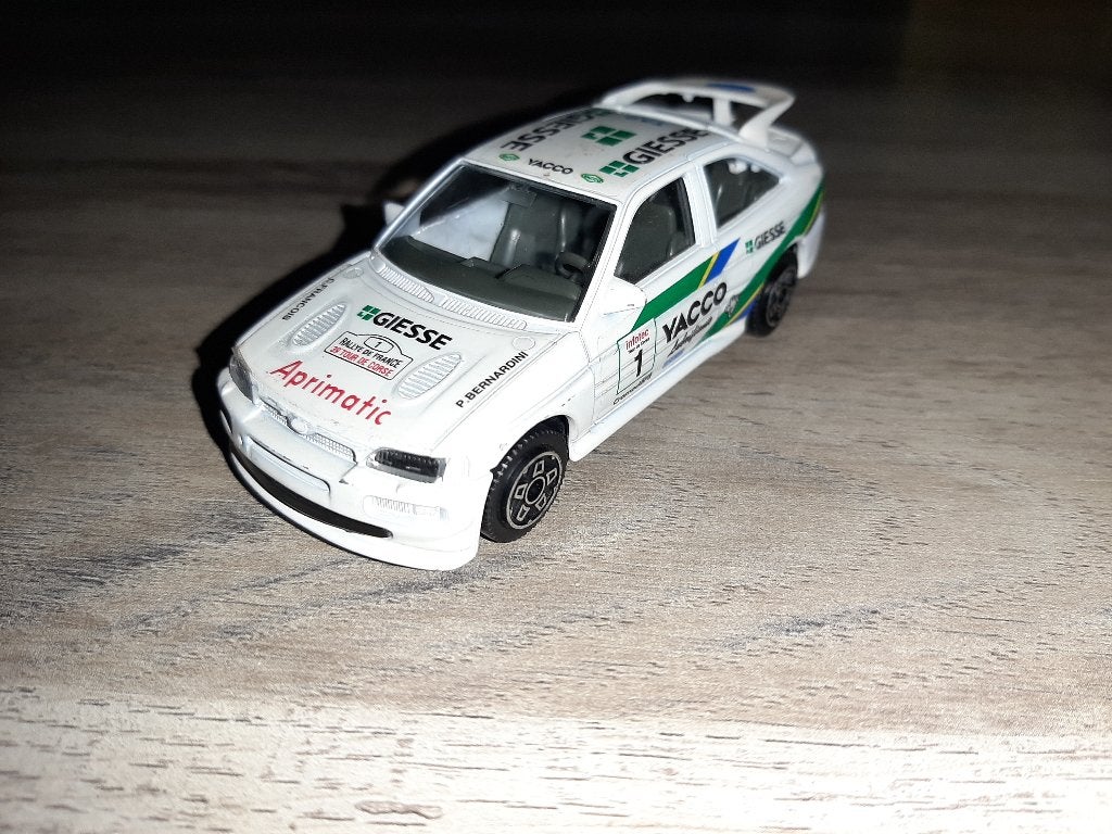Burago 1/43 Ford Escort Cosworth Vacco (nearly mint), Ophalen of Verzenden, Zo goed als nieuw, Auto