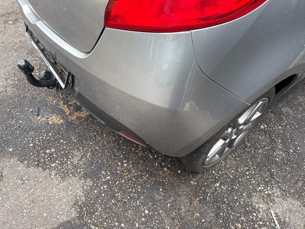 PARE-CHOCS ARRIÈRE Mazda 2 (DE) (01-2007/06-2015), Hitdorfer Straße 73
51371  Leverkusen, DE, Arrière, Pare-chocs, Mazda