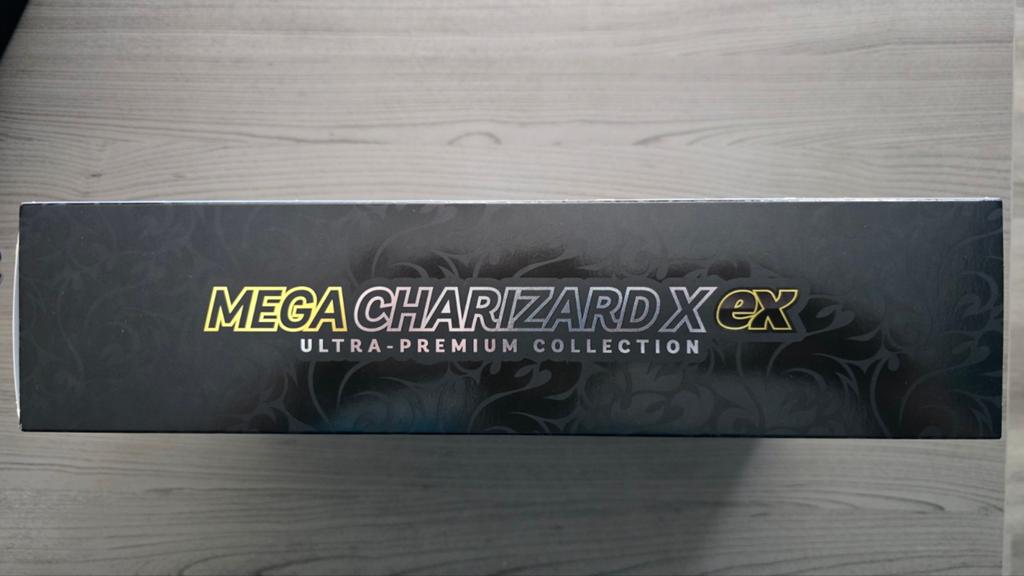 Mega Charizard X ex UPC doos + dobbelstenen/coin/mat/sleeves, Ophalen of Verzenden