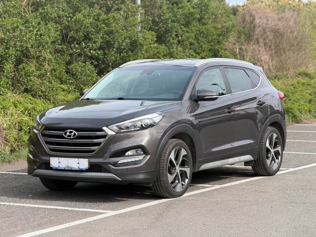 hyundai tucson 1.6 benzine, Voorwielaandrijving, 4 cilinders, Bruin, https://public.car-pass.be/vhr/1d0264ea-c0bc-42d4-94a5-7b27fcffc917