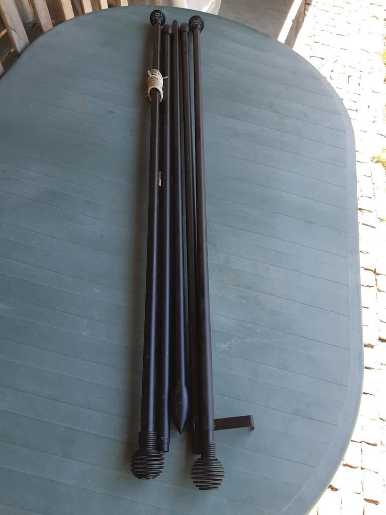 zwarte metalen gordijnroedes, Ophalen