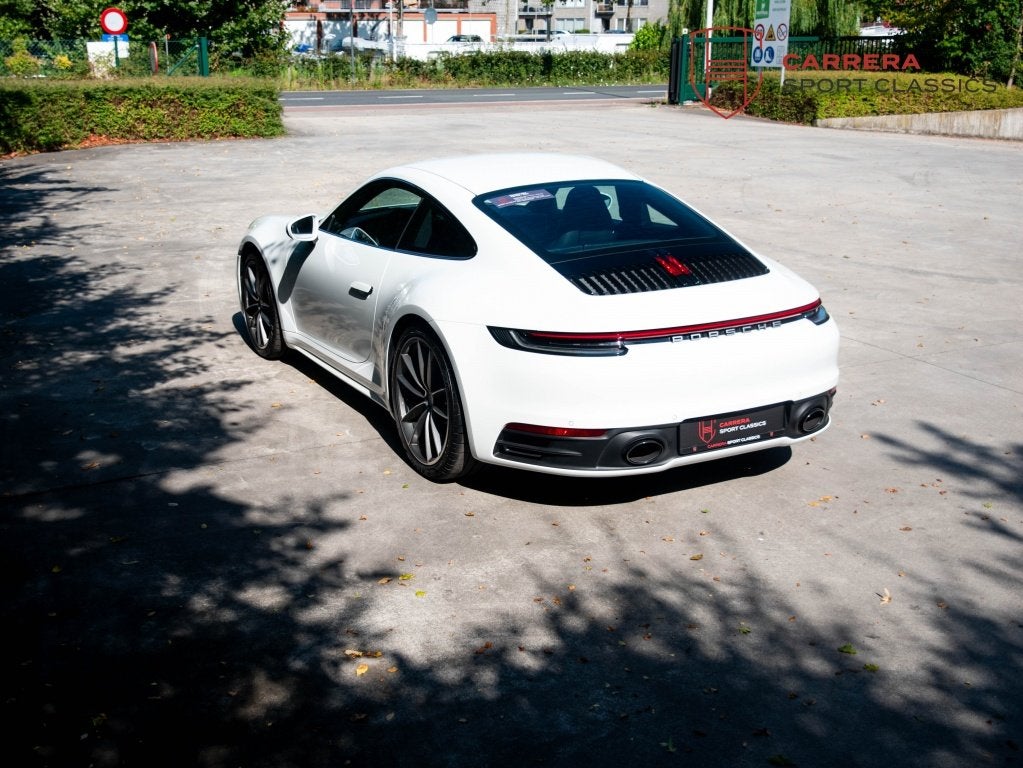 Porsche 911 992 Carrera Coupé 3.0 Carrera / Sport design /, Auto's, Automaat, Gebruikt, Zwart, Automatische klimaatregeling