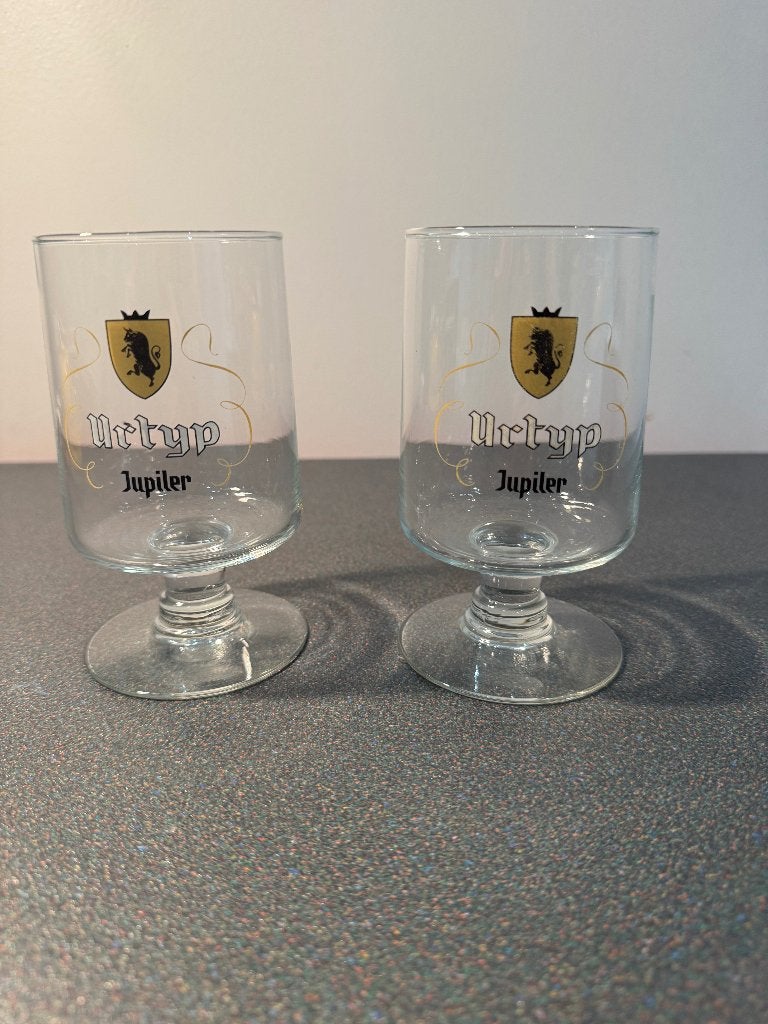 Set van 2 originele Urtyp Jupiler bierglazen – Vintage, Enlèvement, Comme neuf, Verre à bière