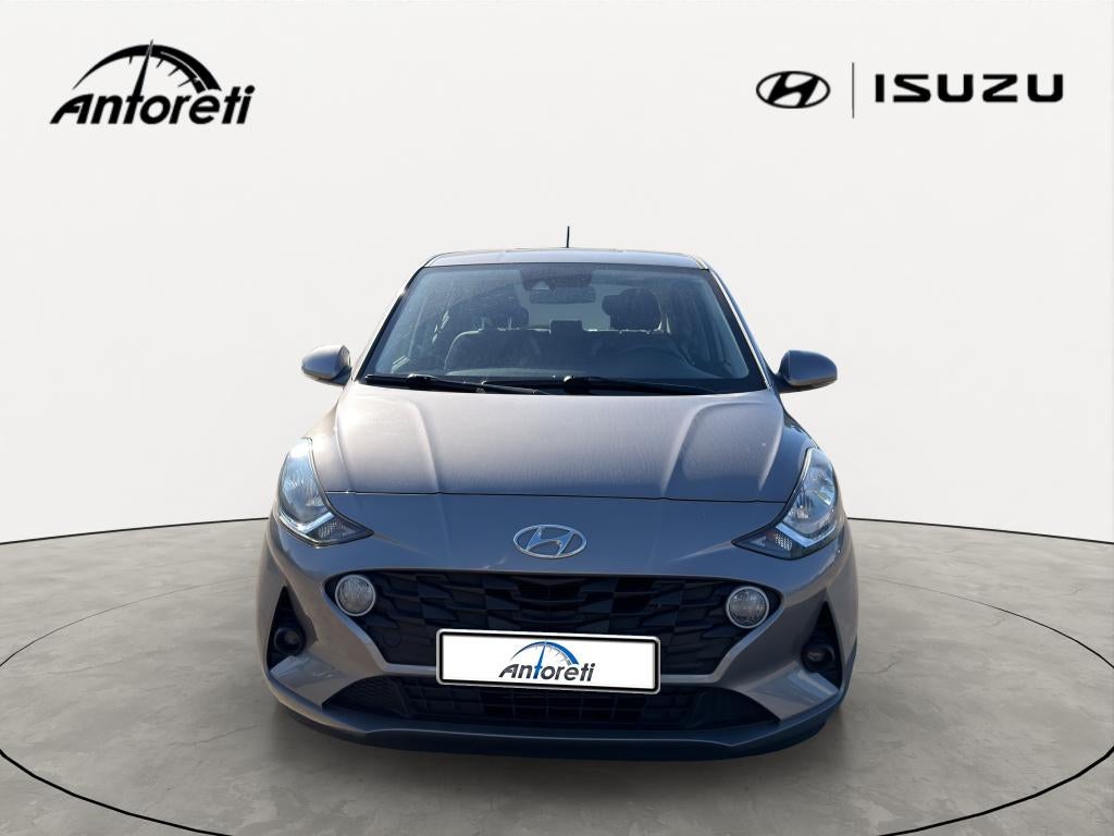 Hyundai i10 1.0i Twist Techno Pack, Auto's, Stof, https://public.car-pass.be/vhr/39bd675b-cd76-40be-9a5e-8b7d53b60380, Beige, 5 zetels